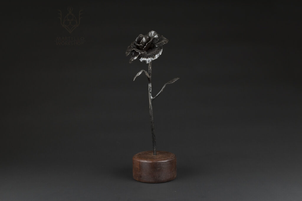 Forged rose standing in wood
