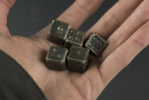 Pile of brass dice