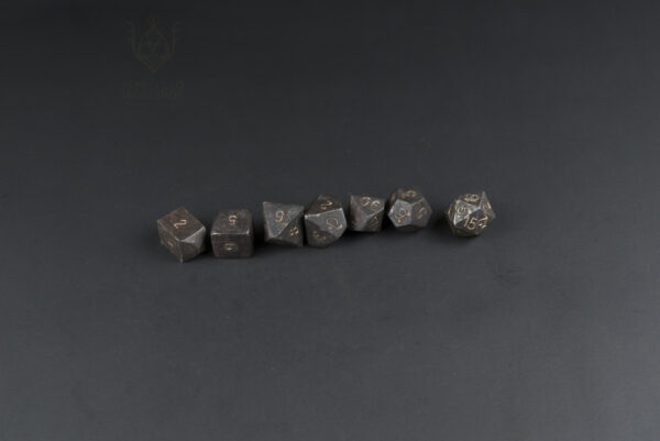 forged steel dnd dice set lined up