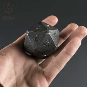 chunky steel d20 in hand